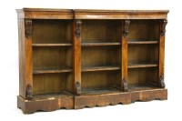 Lot 1105 - A Victorian figured walnut breakfront dwarf open bookcase