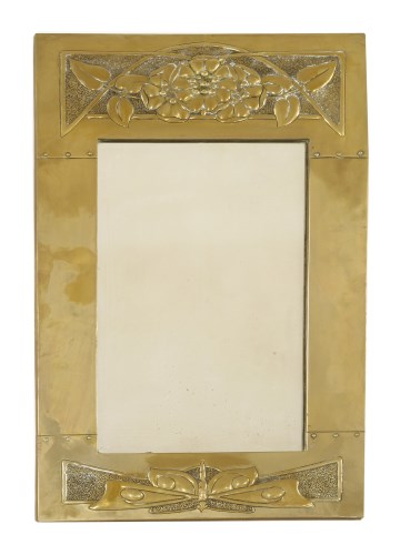 Lot 82 - An Arts and Crafts brass mirror