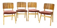 Lot 499 - A set of four beech and walnut laminate chairs (4)