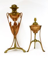 Lot 68 - Two Arts and Crafts copper and brass oil lamp stands