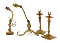 Lot 63 - A pair of brass and copper pricket candlesticks