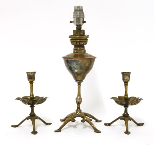 Lot 56 - A pair of W A S Benson silver-plated candlesticks