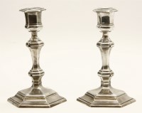 Lot 131 - A pair of Georgian style silver candlesticks