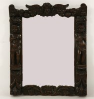 Lot 334 - A carved oak mirror
