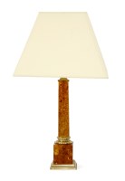 Lot 624 - An amber resin and brass table lamp