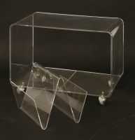 Lot 533 - A clear lucite trolley