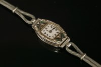 Lot 169 - A ladies' Swiss platinum Art Deco emerald and diamond cocktail watch