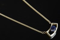 Lot 704 - An Italian gold single stone sapphire pendant necklace