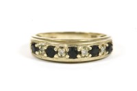 Lot 28 - A 9ct gold sapphire and diamond half eternity ring