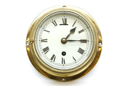 Lot 184 - An Astral brass ship's clock