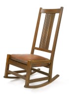 Lot 13 - An oak rocking chair