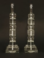 Lot 666 - A pair of clear glass lamps