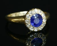 Lot 113 - An Edwardian sapphire and diamond circular cluster ring