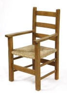 Lot 102 - An Heal's Letchworth oak child's elbow chair