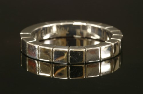 Lot 405 - An 18t white gold Cartier Lanieres flat section band ring