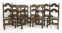 Lot 730 - A harlequin set of eight oak carved dining chairs