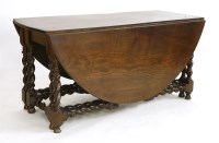 Lot 724 - An early 19th oak gate leg table