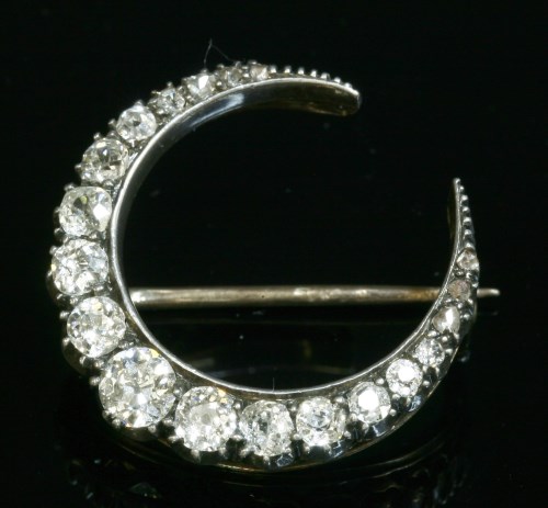 Lot 83 - A late Victorian diamond set crescent brooch or fourcher