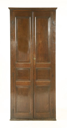 Lot 918 - A George III oak standing corner cabinet