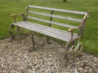Lot 1096 - A Coalbrookdale grape and serpent cast iron garden bench