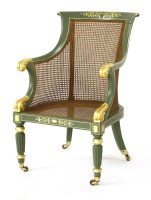 Lot 1101 - A Regency-style painted library armchair