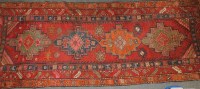 Lot 684 - A Middle Eastern red ground runner