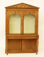 Lot 746 - An oak display cabinet