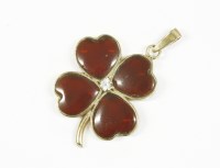 Lot 2 - A 9ct gold garnet and white stone shamrock or four leafed clover pendant
