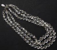 Lot 16A - A three row graduated faceted bouton shaped rock crystal bead necklace