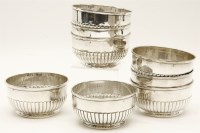Lot 199 - A set of eight continental white metal bowls of half gadrooned form