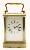 Lot 161A - A French lacquered brass and fire glass carriage clock