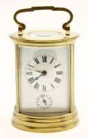 Lot 157 - A 20th century lacquered brass circular carriage alarm clock