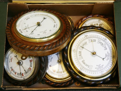 Lot 336 - Seven various oak and walnut cased 'rope twist' aneroid barometers
