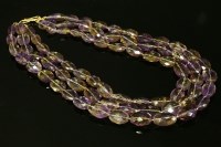 Lot 733 - A three row oval faceted ametrine bead necklace