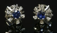 Lot 267 - A pair of 18ct white gold sapphire and diamond cluster earrings