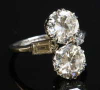 Lot 156 - An Art Deco two stone diamond fingerline ring