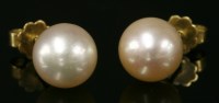 Lot 711 - A pair of gold single stone cultured pearl stud earrings