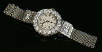 Lot 149 - A ladies' platinum and gold Vacheron & Constantin diamond set mechanical bracelet watch
