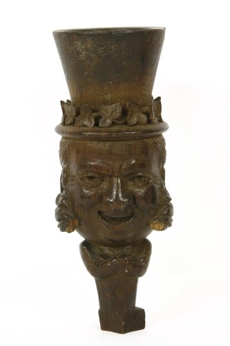 Lot 295 - An oak carving of a Gentleman in a top hat