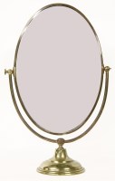 Lot 257 - An oval brass mounted toilet mirror