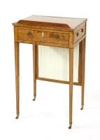 Lot 1058 - A George III strung satinwood writing table