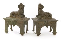 Lot 1154 - A pair of cast bronze chenets
