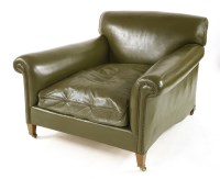 Lot 1135 - A green leather armchair