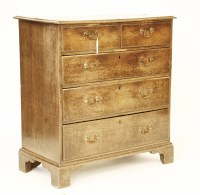 Lot 688 - A George III oak straight front chest