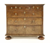 Lot 1209 - A walnut chest of drawers