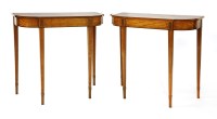 Lot 1067 - A pair of strung and crossbanded satinwood pier tables