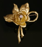 Lot 242 - An 18ct gold single stone diamond rose brooch