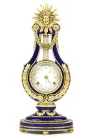 Lot 210 - A cobalt blue and gilt mounted Sevres style lyre clock