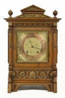 Lot 219 - A oak cased table clock