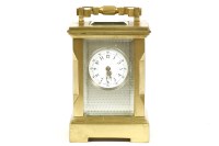 Lot 156 - A gilt brass cased miniature bevelled glass carriage clock